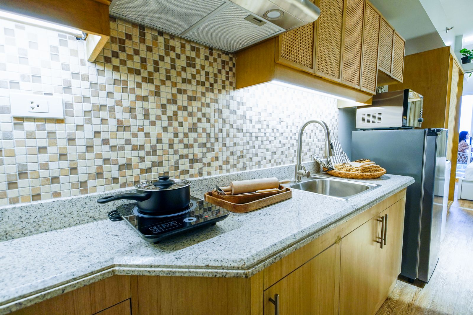 Cooking with a pan on an induction cooktop — professional Miele cooktop repair
