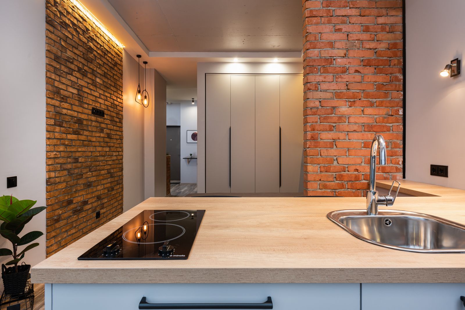 Pots heating on a built-in cooktop — professional Miele cooktop repair