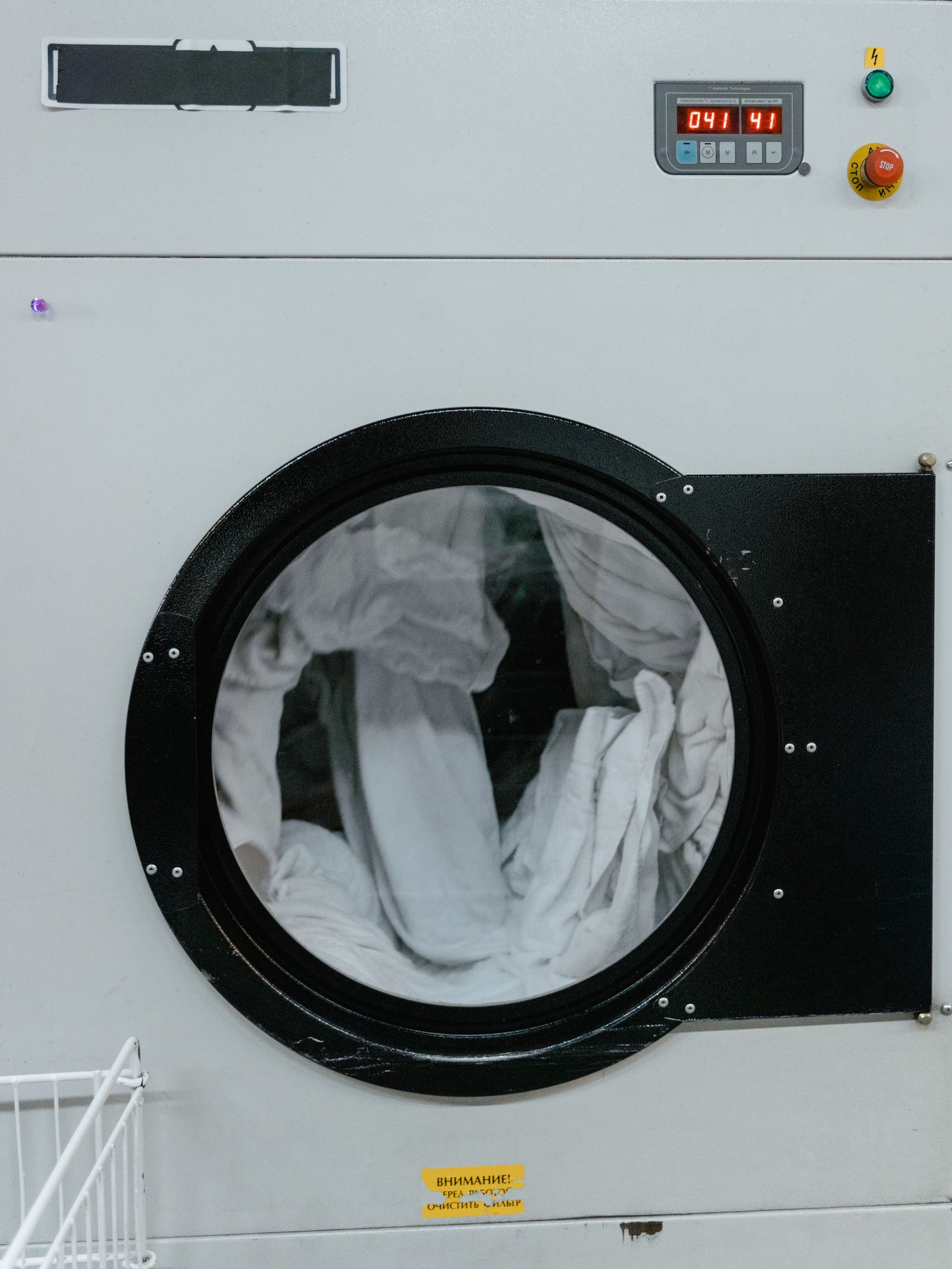 A clean white front-load tumble dryer — professional Miele dryer repair