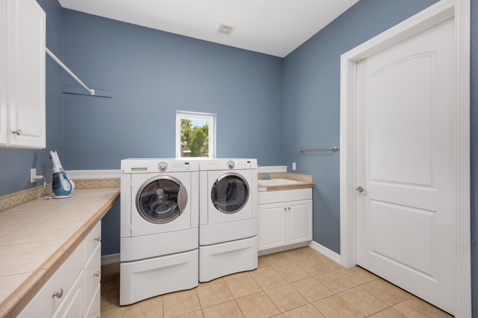 A home laundry room with a washer and dryer — local Miele appliance repair