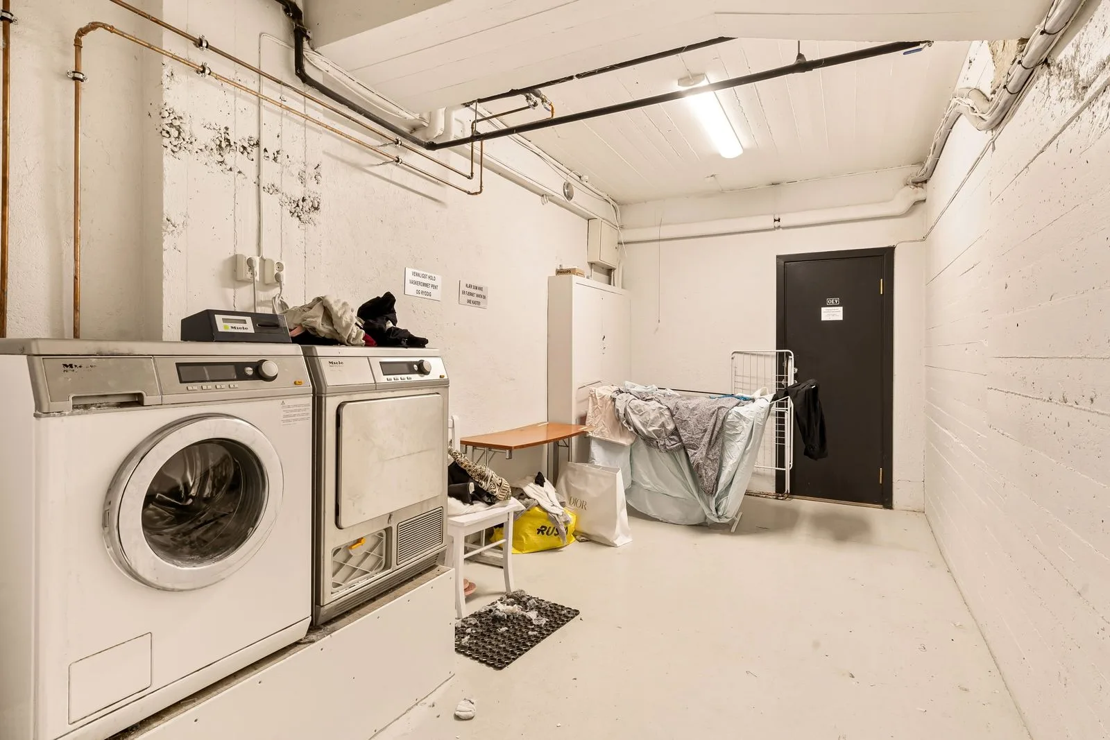 A home laundry room with a washer and dryer — local Miele appliance repair