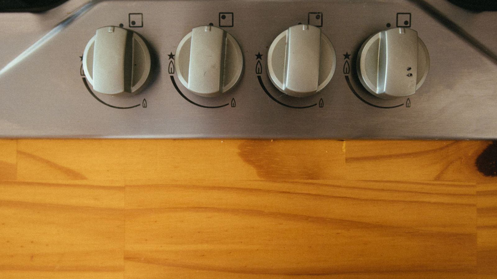 The control knobs of a professional gas rangetop — professional Miele rangetop repair